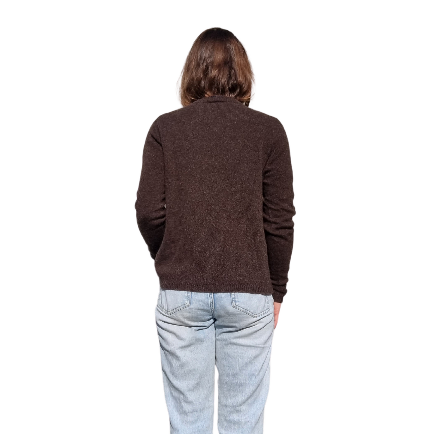 Everyday jumper with a drew neckline and ribbed cuffs and hem in a  kiwi brown colour on a brunette women. The sweater is made locally and ethically in New Zealand by a female designer. Knitwear is made from Merino Possum and silk fiber