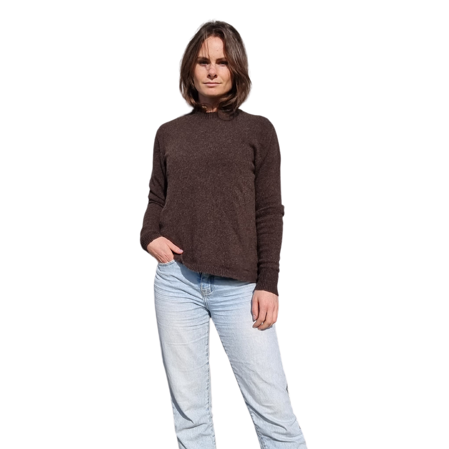 Everyday jumper with a drew neckline and ribbed cuffs and hem in a  kiwi brown colour on a brunette women. The sweater is made locally and ethically in New Zealand by a female designer. Knitwear is made from Merino Possum and silk fiber