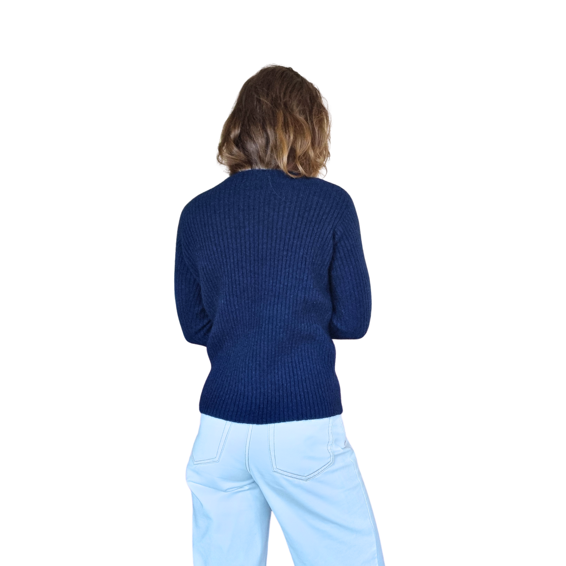 Brunette women wearing a ink blue Merino Possum Nylon Sweater that has a mock neck, long ribbed sleeves and a ribbed body. Jumper is made in New Zealand