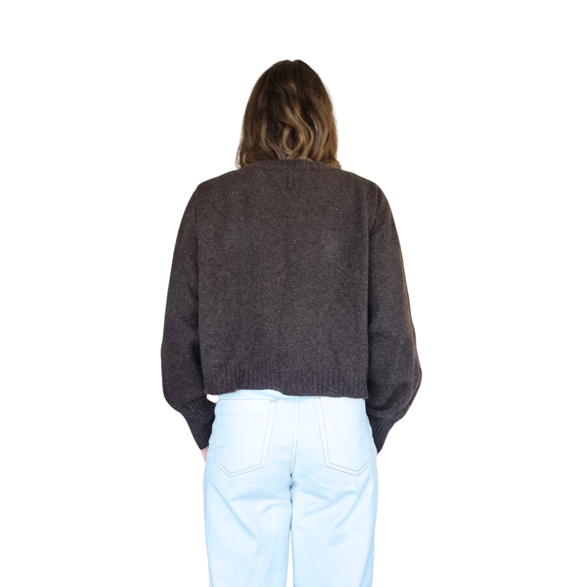 Crew neckline cropped boxy jumper woth rib detail along sleeve. Loose fit cuffs and hem sitting at waist section. Made in New Zealand from Merino Possum and Silk. Favourite Jumper currently trending