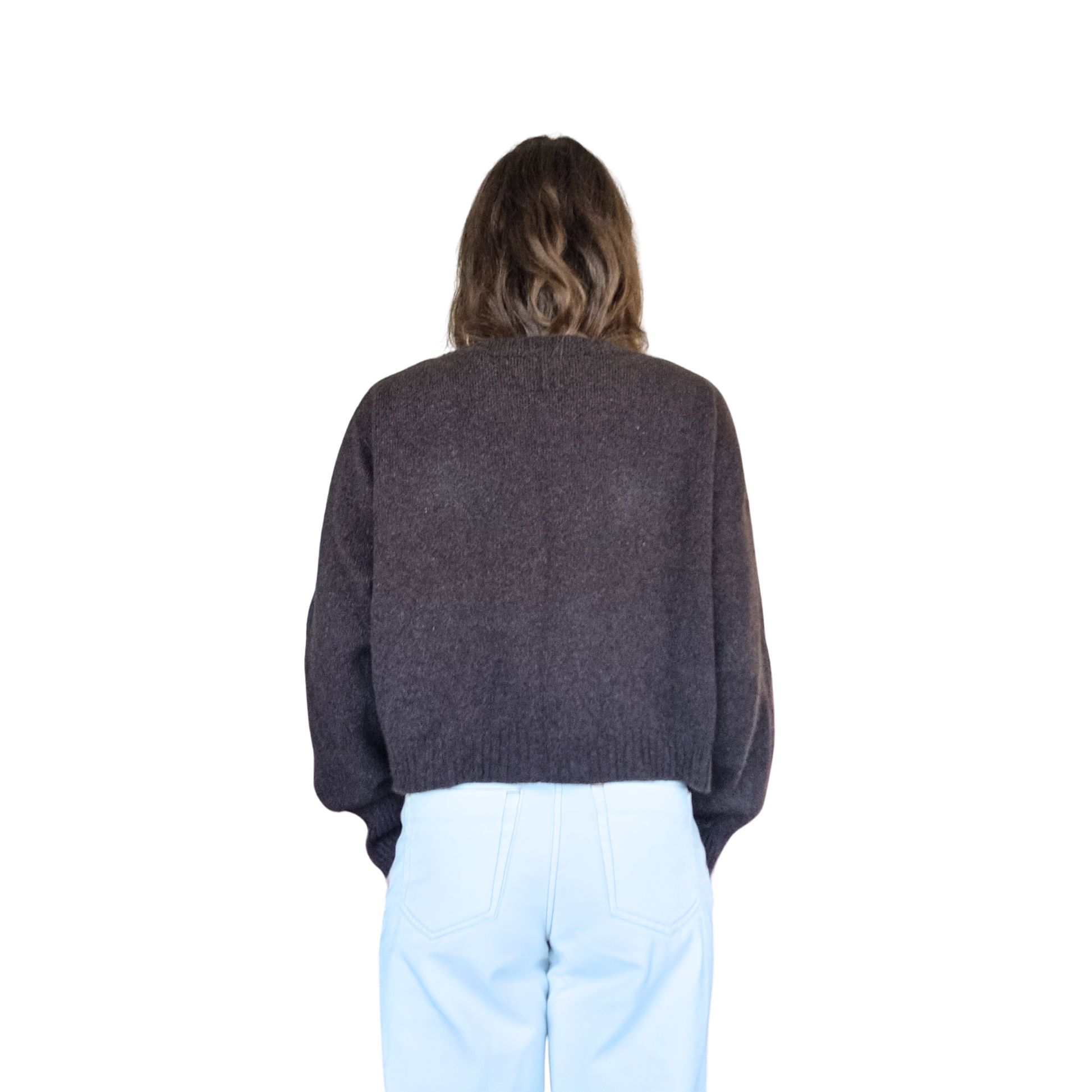 Crew neckline cropped boxy jumper woth rib detail along sleeve. Loose fit cuffs and hem sitting at waist section. Made in New Zealand from Merino Possum and Silk. Favourite Jumper currently trending