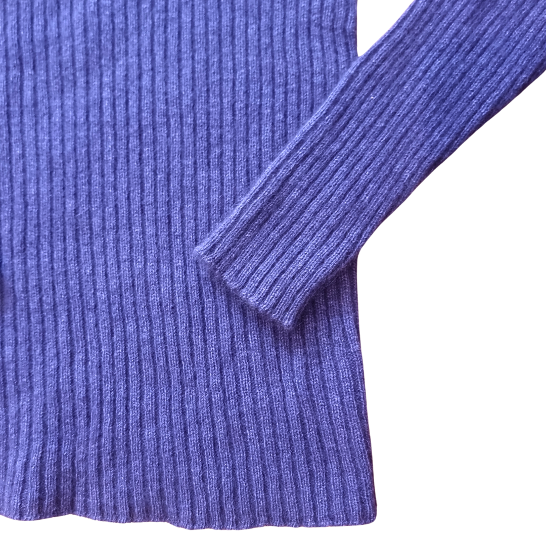Close-up of an purple ribbed jumper