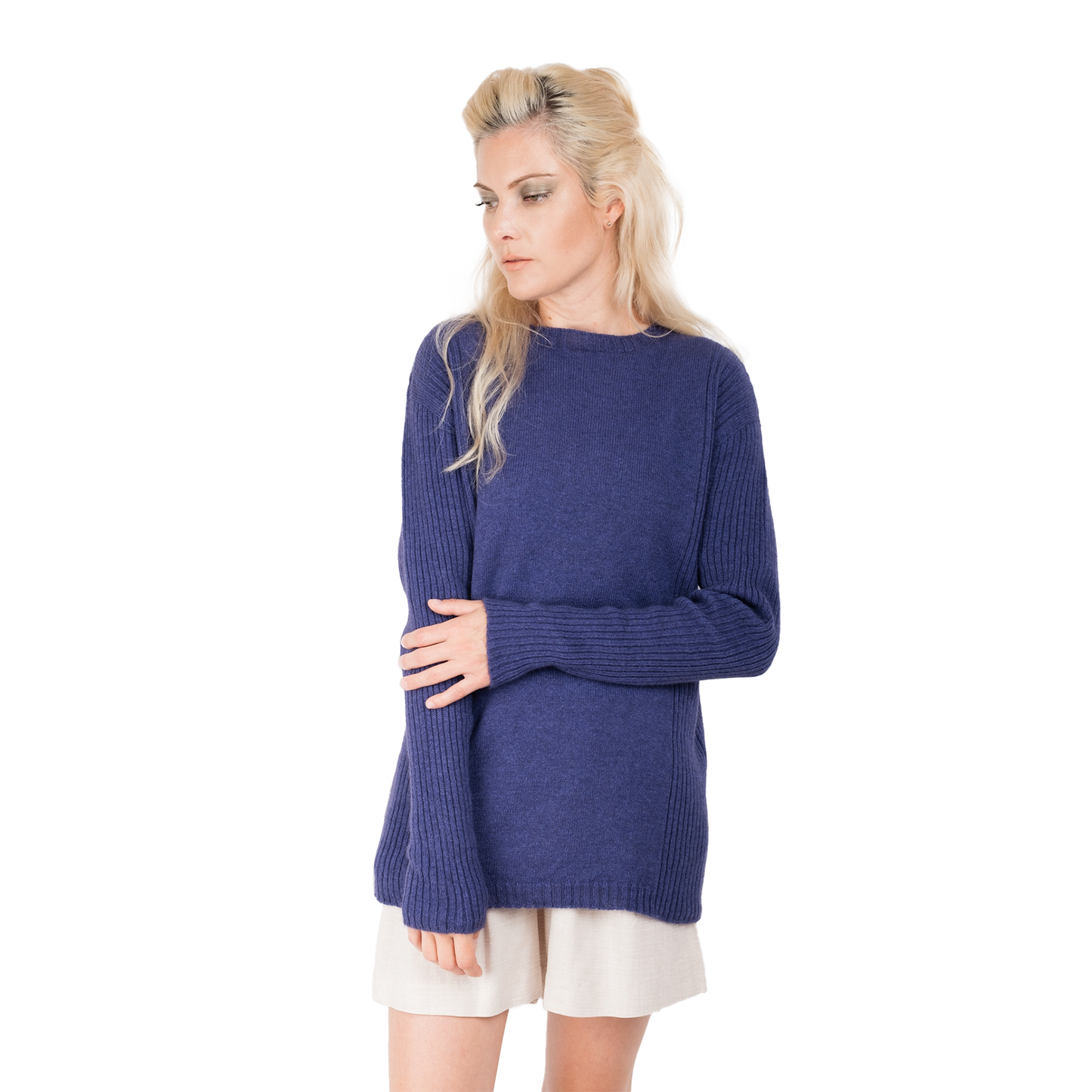 Blonde lady wearing a purple cashmere possum silk sweater. It has long ribbed sleeves and rib stripes down the sides of the body. Made in New zealand