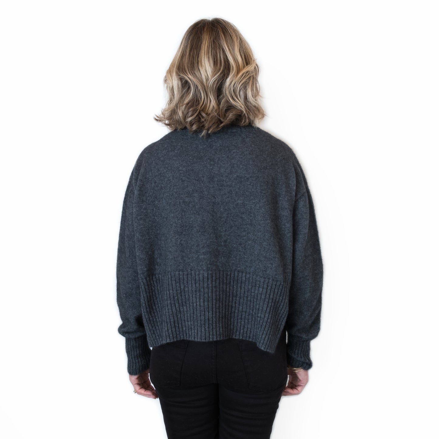 Split Hem Sweater in colour Charcoal. Loose turtleneck. Back