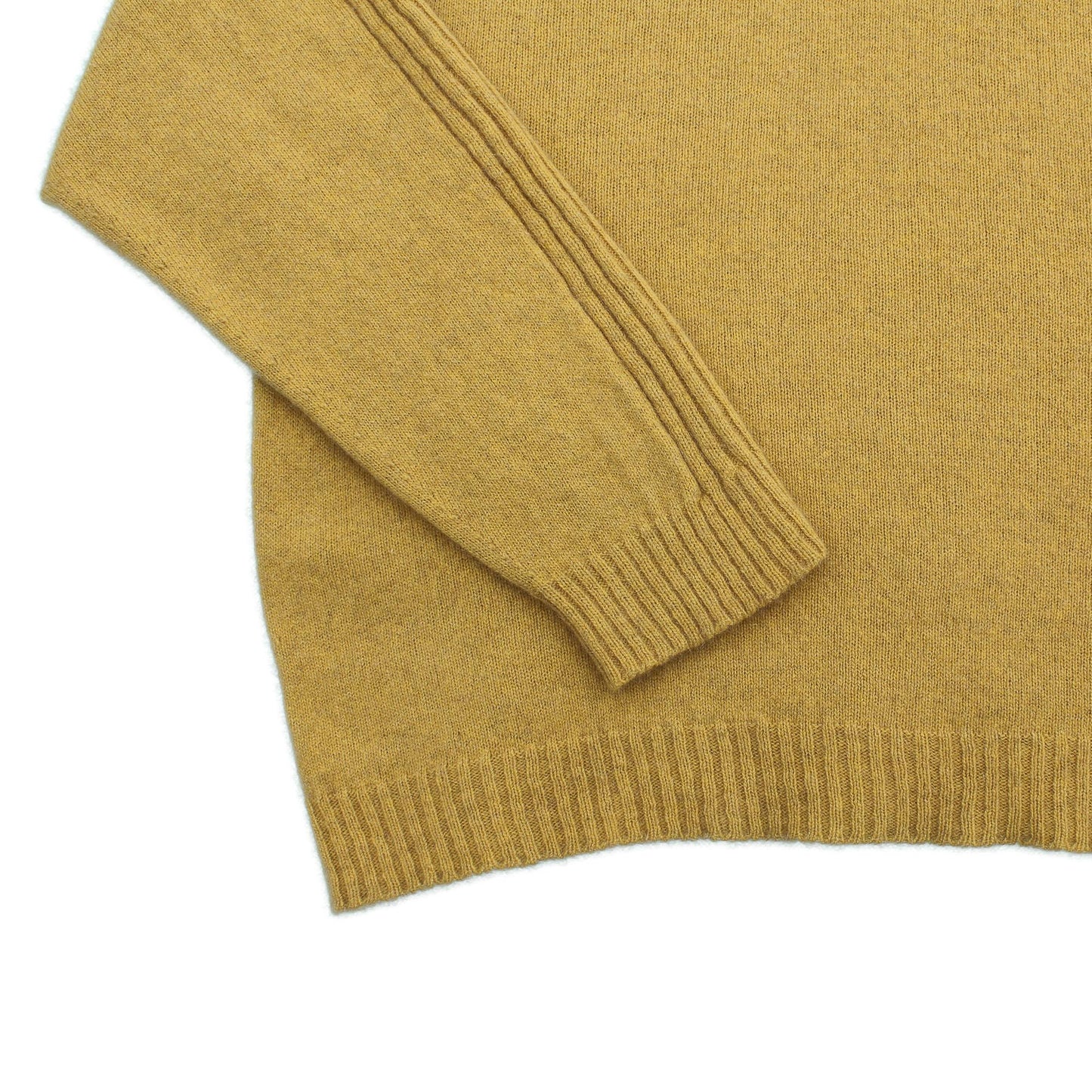 Sports stripe sweater with a turtle neck and long sleeves in a sunshin yellow. Made in NZ from New Zelaand Merino Possum and Silk. detail of sleeve cuff and hem