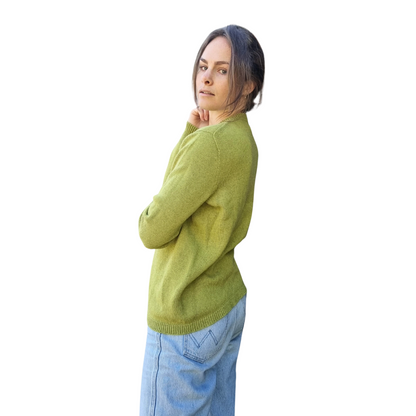 Pear green coloured Cashmere Possum silk jumper on a woman. Sweater is made in locally in New Zealand by female manufacturer