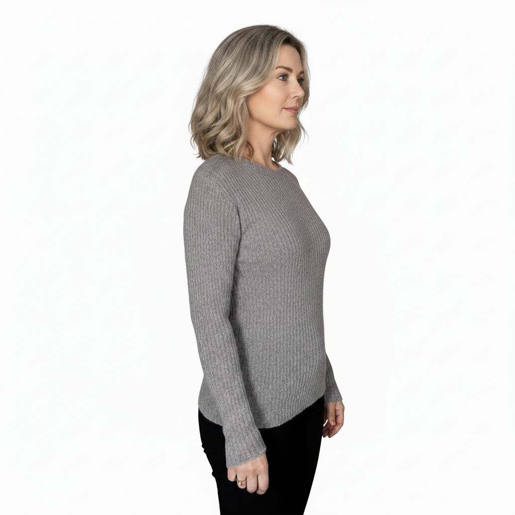 Woman wearing a gray sweater on a white background