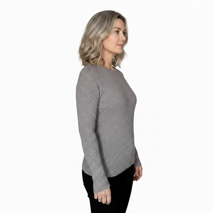 Woman wearing a gray sweater on a white background