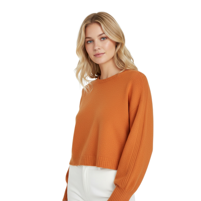 Woman wearing an orange sweater on a white background