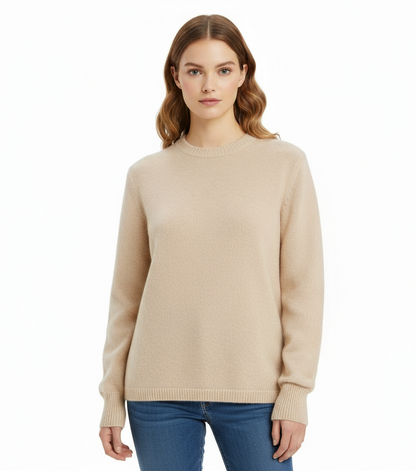 Woman wearing a beige sweater on a white background