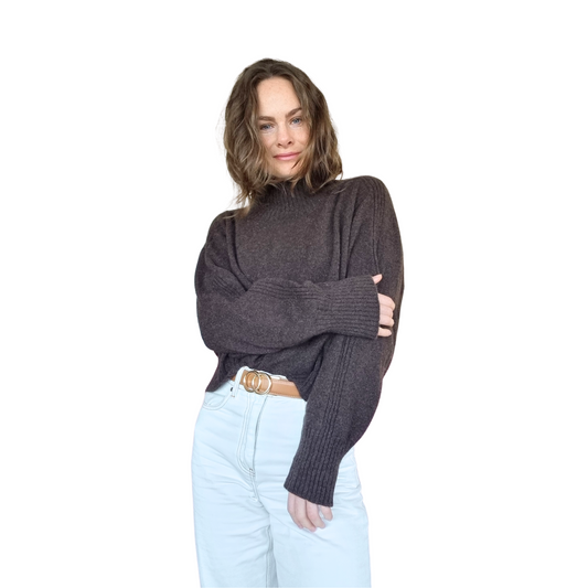 Relaxed turtleneck Sweater with a cropped hem. Made in a chocolate brown coloured yarn from Merino Possum and silk. Made in New Zealand. Long sleeves with rib detail from shoulder to cuff