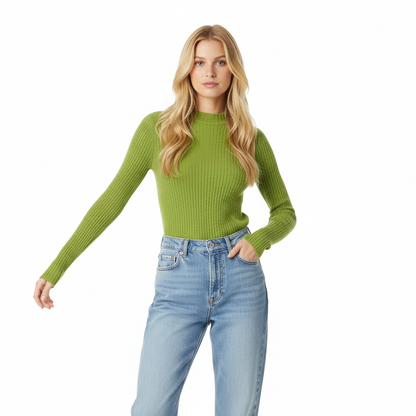 Woman wearing a green ribbed sweater and light blue jeans on a white background