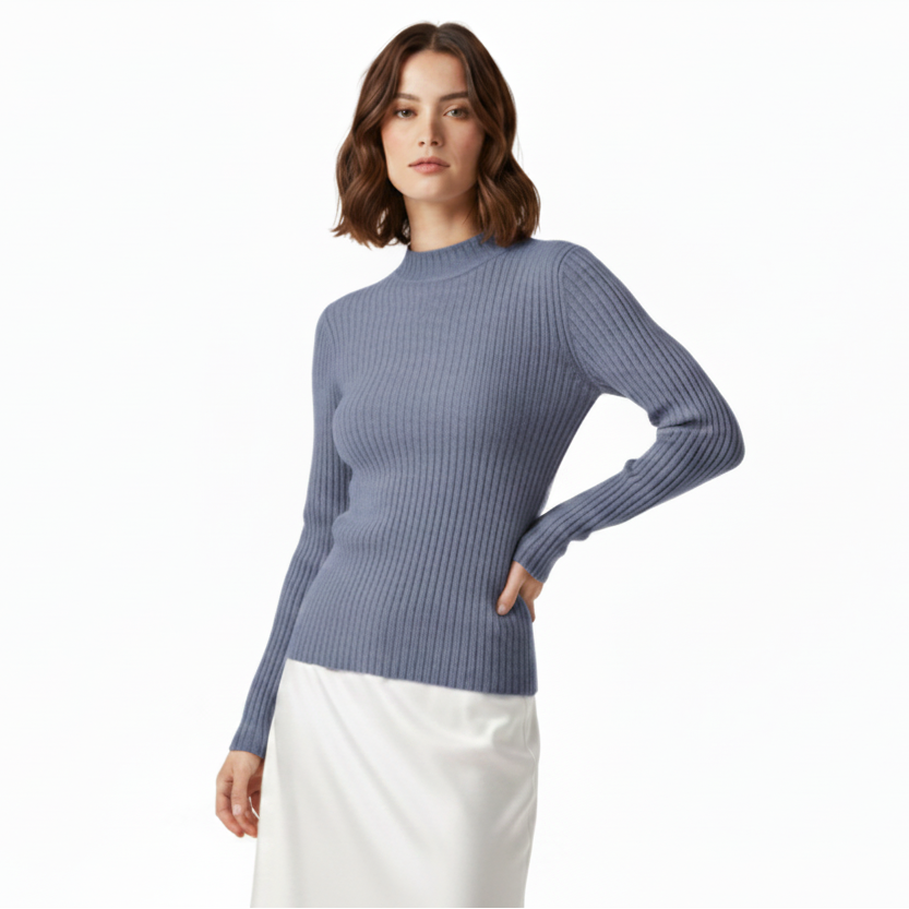 Woman wearing a purple sweater and white pants on a white background