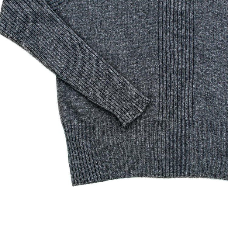 Centre front rib knit sweater in colour charcoal. Made from NZ merino Possum and nylon. Detail of hem