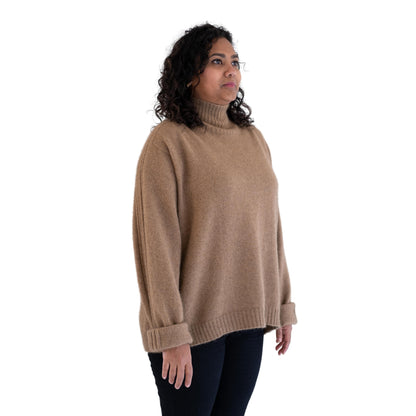 Sports Stripe Jumper in colour caramel. Side. New Zealand made Merino possum Angora and silk jumper in a caramel brown and oversize shape