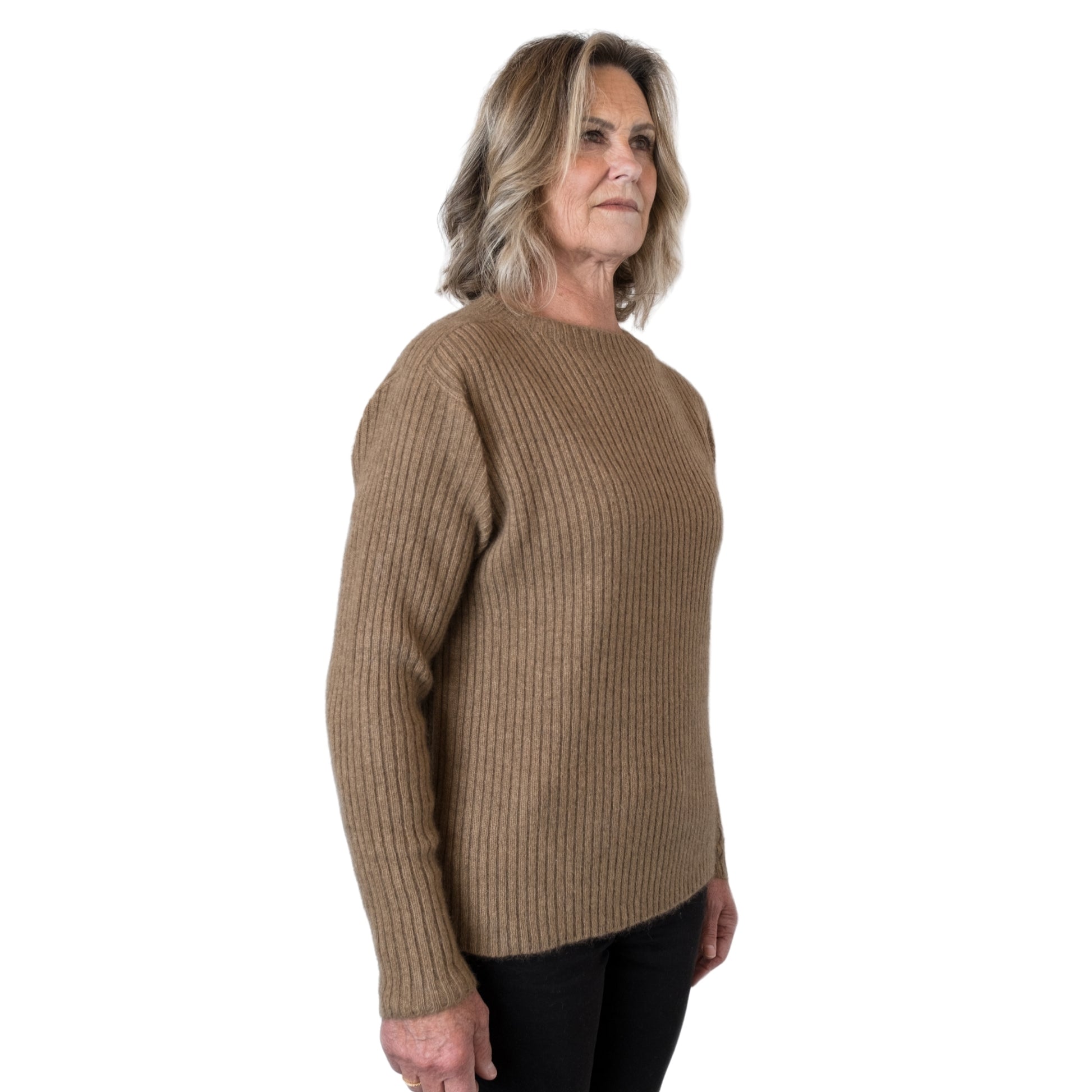  New Zealand made Merino possum Angora and silk jumper in a caramel brown. Fully ribbed sweater with long ribbed sleeves and a mock neck. Side view